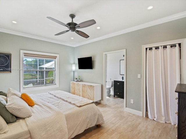 bedroom featuring recessed lighting, ornamental molding, connected bathroom, light wood-type flooring, and baseboards