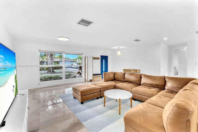 living room featuring visible vents