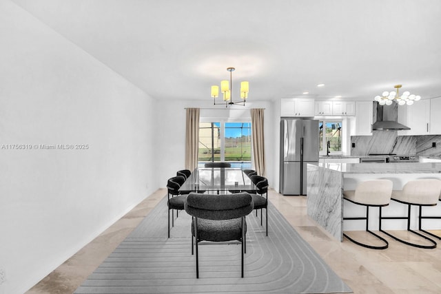 dining space with a chandelier and recessed lighting