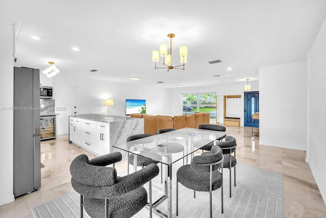 dining room featuring wine cooler, recessed lighting, visible vents, and an inviting chandelier