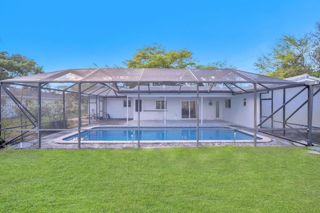 rear view of house featuring a patio area, glass enclosure, an outdoor pool, and a yard