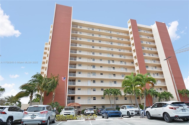 view of property featuring uncovered parking