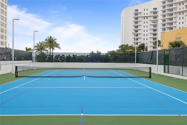 view of sport court with community basketball court and fence