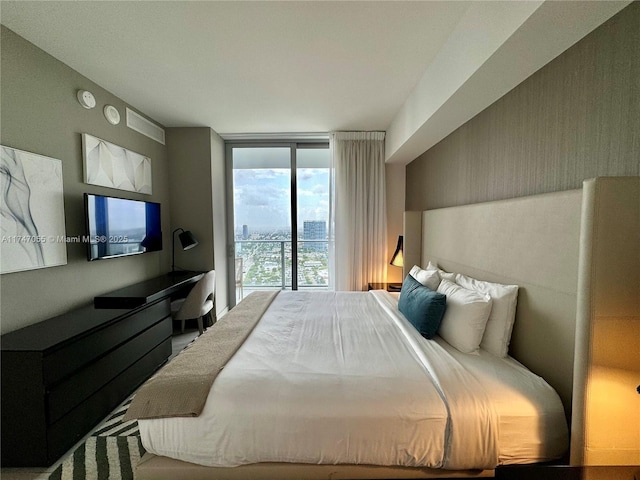 bedroom featuring expansive windows