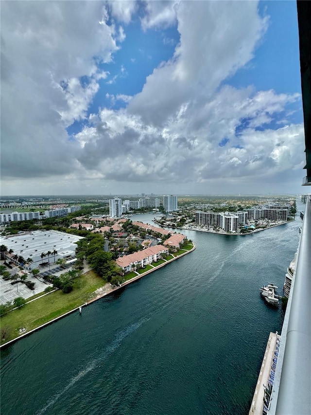 bird's eye view featuring a water view and a city view