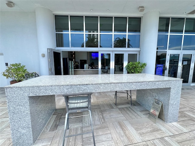 exterior space with french doors and outdoor dry bar