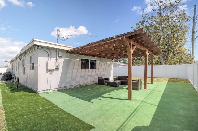 exterior space featuring a patio, a yard, a fenced backyard, and an outdoor living space