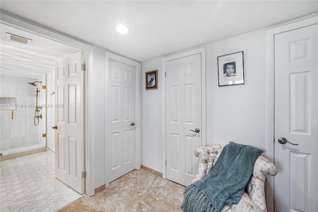 living area featuring visible vents and baseboards