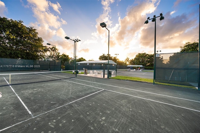 view of sport court featuring fence