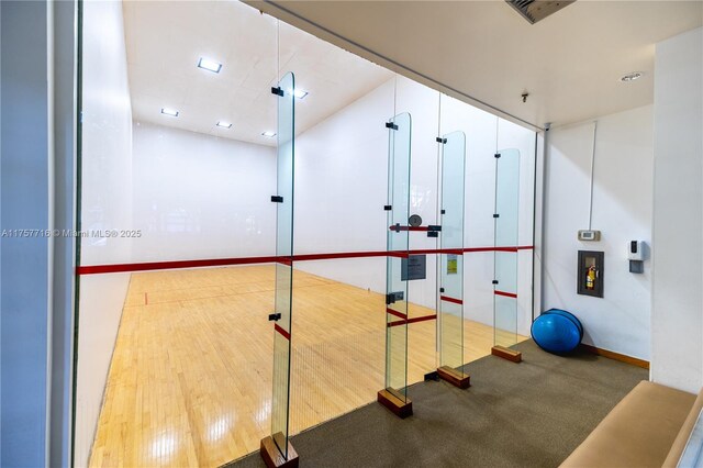 exercise room featuring a sport court and visible vents