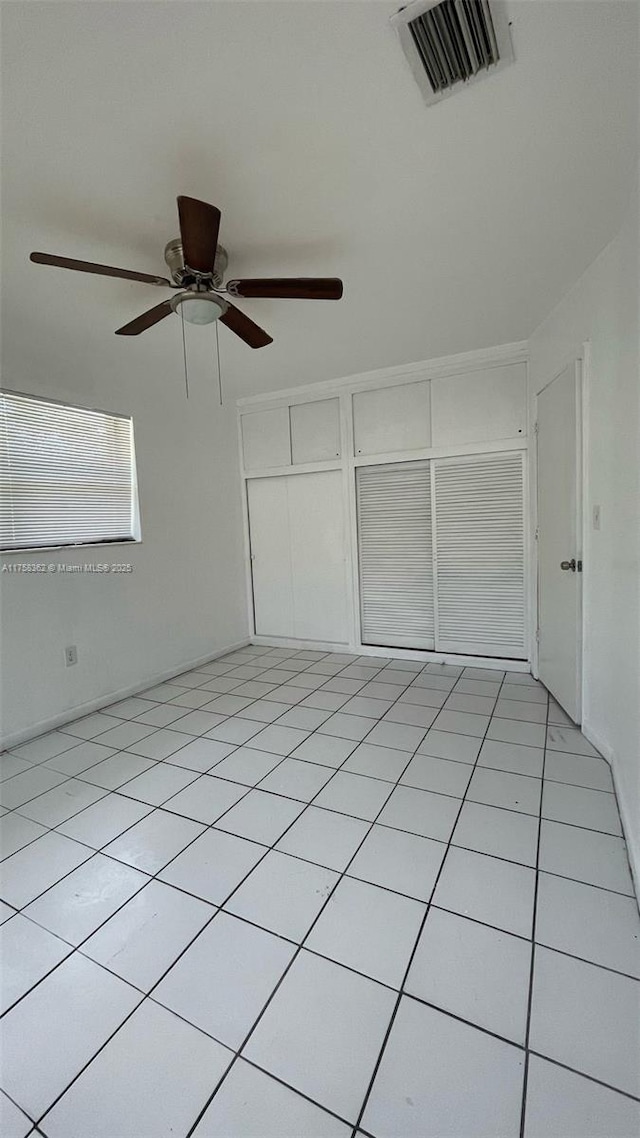 spare room featuring visible vents and light tile patterned floors