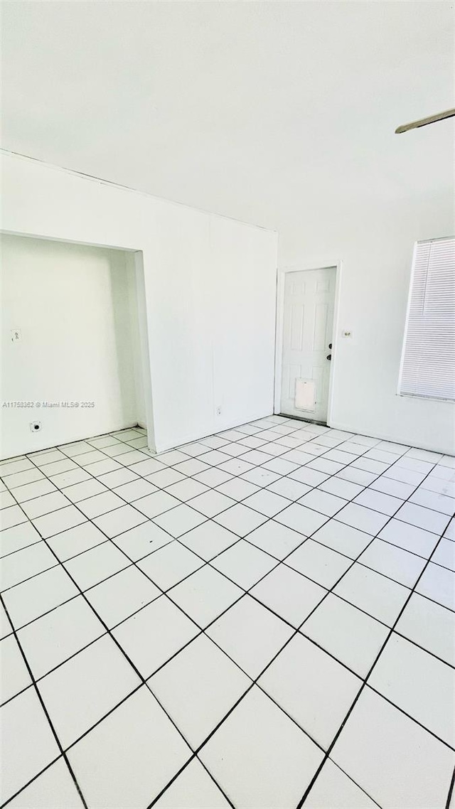 spare room with light tile patterned floors