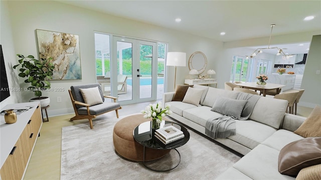 living room with recessed lighting, french doors, and baseboards