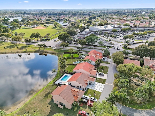 drone / aerial view featuring a water view and a residential view