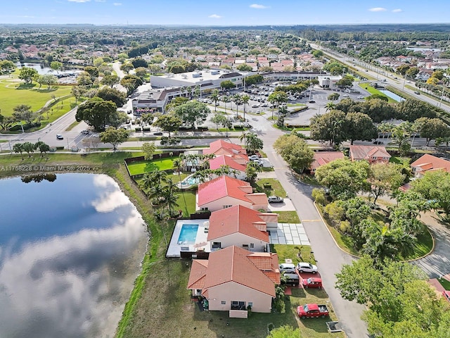 drone / aerial view with a water view