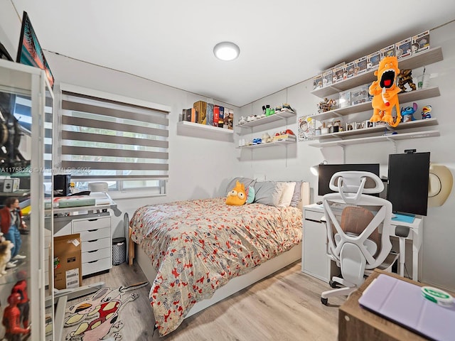 bedroom featuring wood finished floors