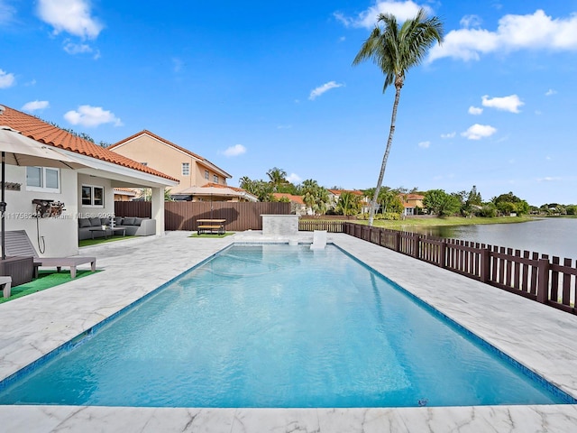 view of swimming pool with a fenced in pool, a patio, a fenced backyard, and outdoor lounge area