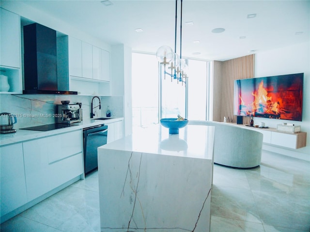 kitchen featuring dishwasher, modern cabinets, white cabinetry, a sink, and exhaust hood