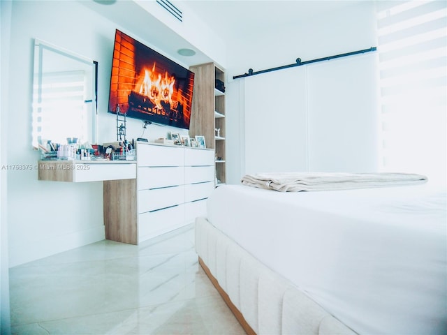 bedroom with marble finish floor and visible vents