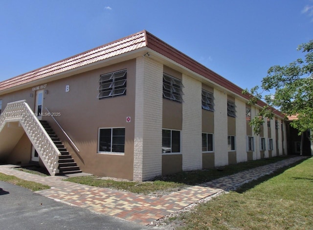 view of property featuring stairs