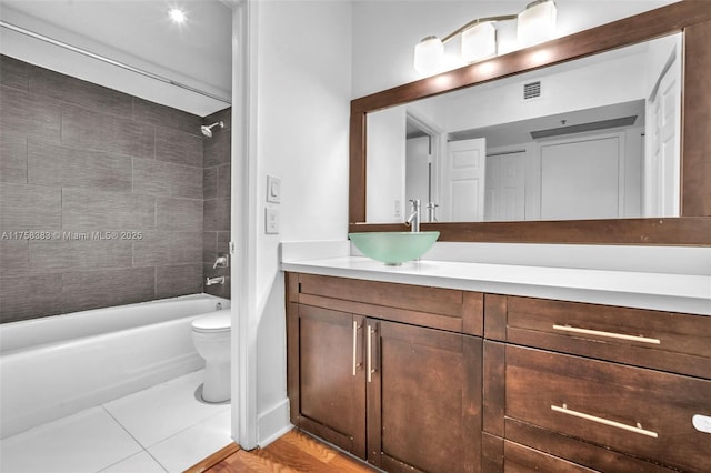 bathroom featuring bathtub / shower combination, visible vents, vanity, and toilet