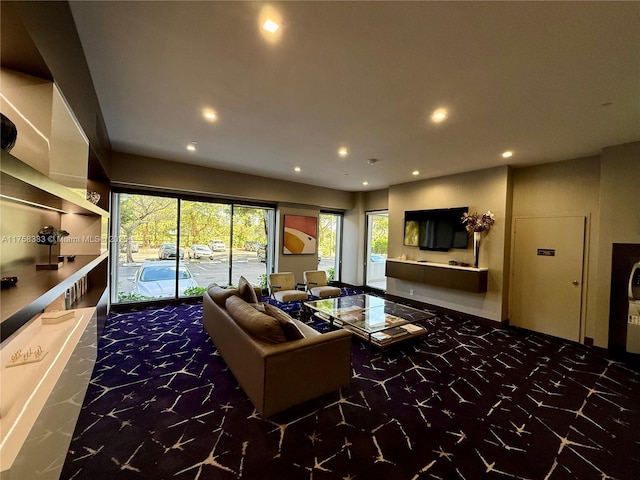 carpeted living area with recessed lighting