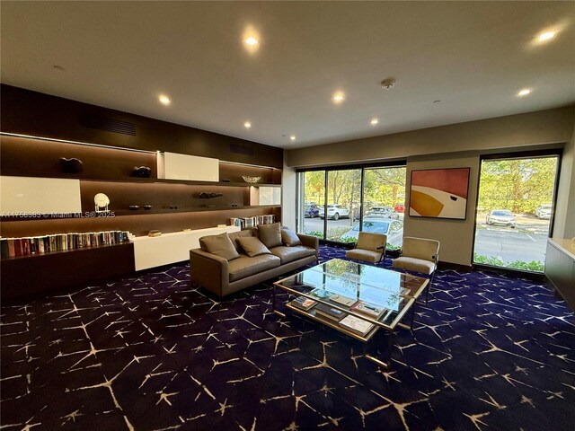 carpeted living area featuring recessed lighting