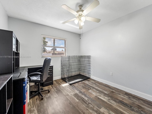 office with ceiling fan, a textured ceiling, baseboards, and wood finished floors