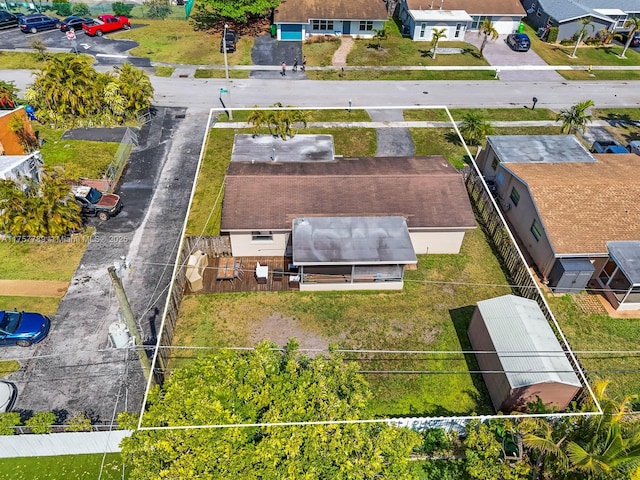 birds eye view of property with a residential view