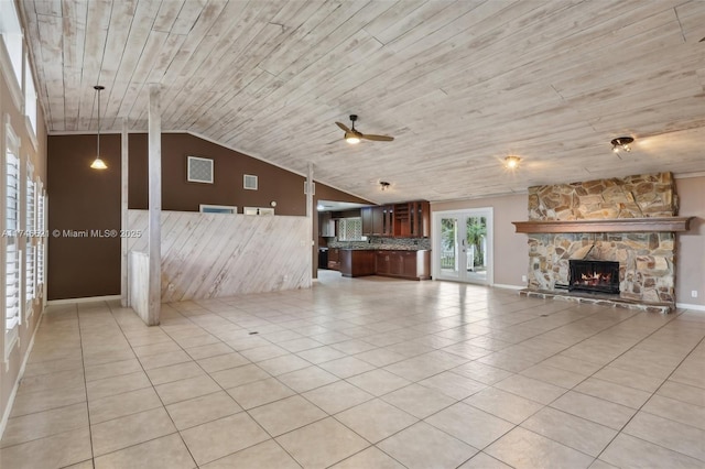 unfurnished living room featuring a fireplace, light tile patterned floors, a ceiling fan, vaulted ceiling, and wooden ceiling