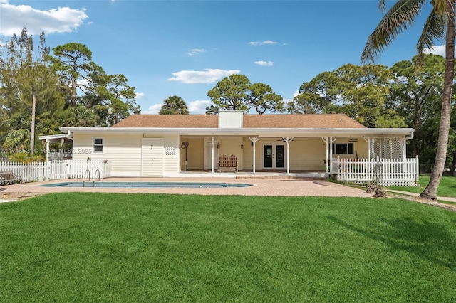 back of house with french doors, a yard, a patio, fence, and ceiling fan