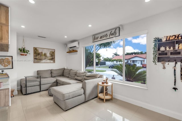 living room with recessed lighting, visible vents, an AC wall unit, light tile patterned flooring, and baseboards