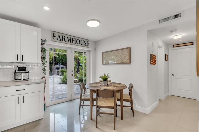 dining room with french doors, recessed lighting, visible vents, light tile patterned flooring, and baseboards