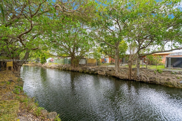 view of water feature with fence