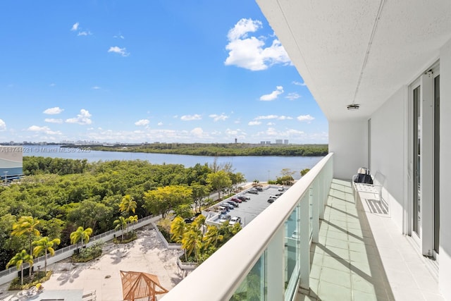 balcony featuring a water view