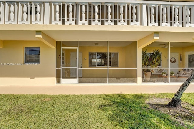 exterior space featuring a balcony and stucco siding