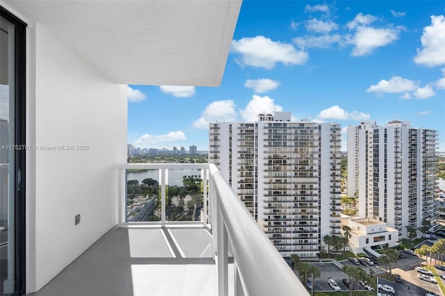 balcony featuring a view of city and a water view