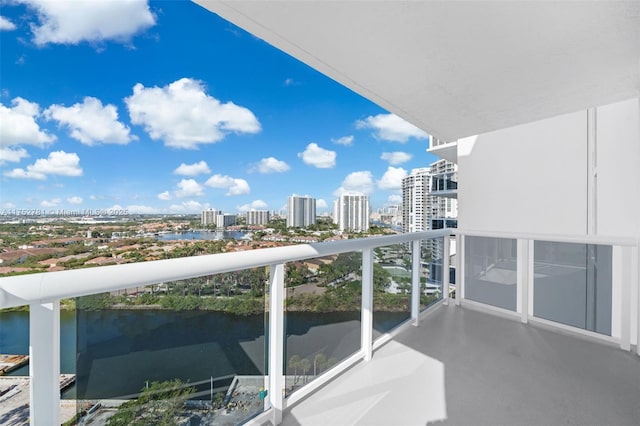 balcony with a view of city and a water view