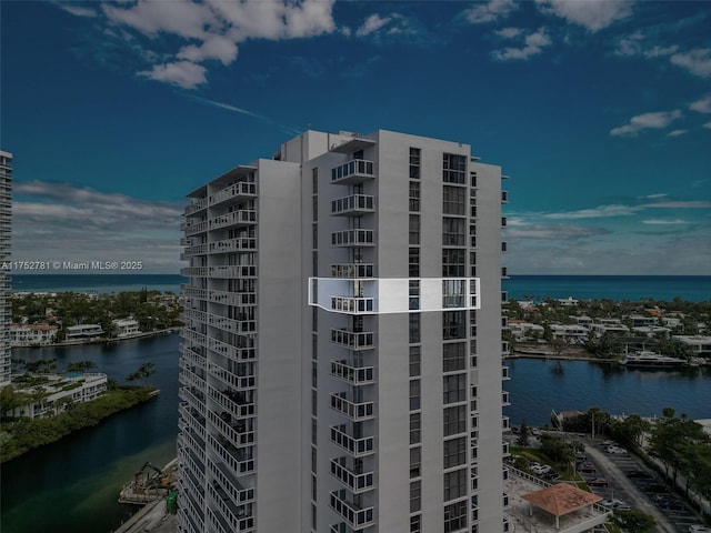 view of building exterior with a water view