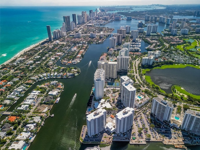 aerial view with a water view and a view of city