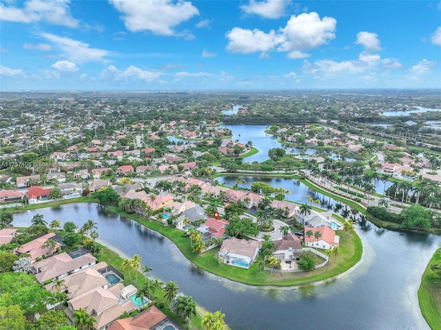 birds eye view of property featuring a water view and a residential view