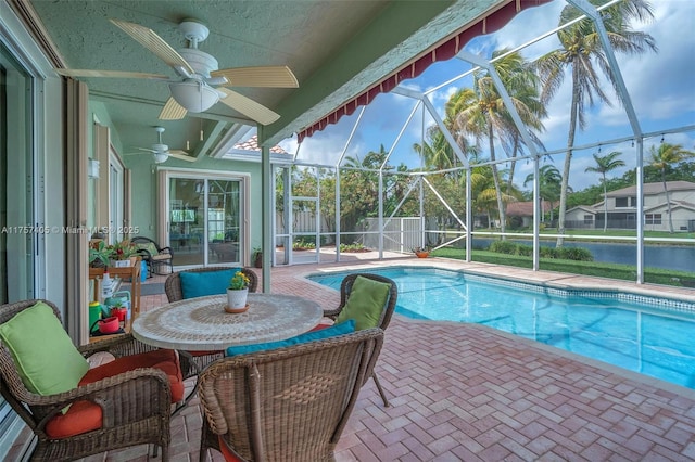 view of pool with a fenced in pool, a patio, ceiling fan, fence, and a lanai