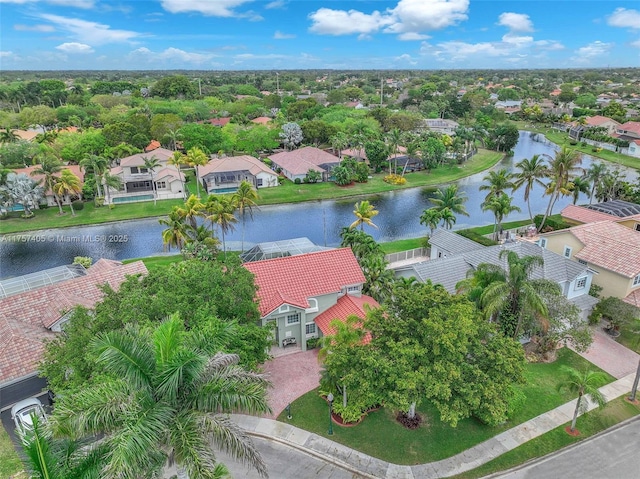 birds eye view of property with a residential view and a water view