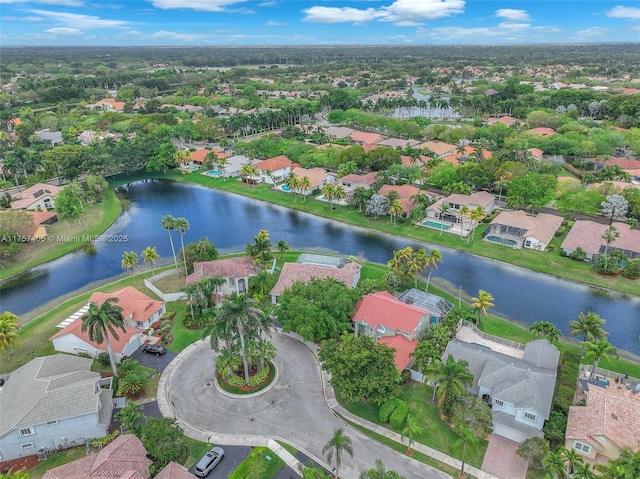 birds eye view of property with a water view and a residential view