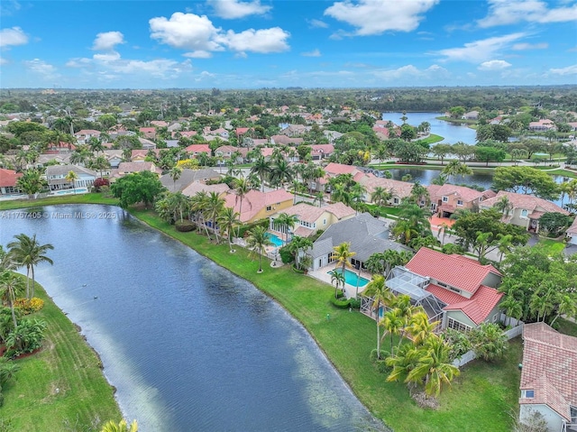 drone / aerial view with a water view and a residential view