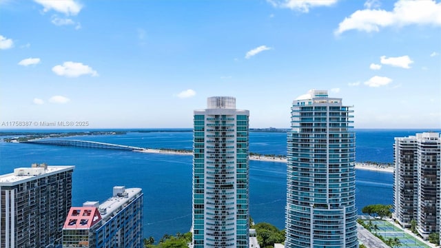 aerial view featuring a view of city and a water view