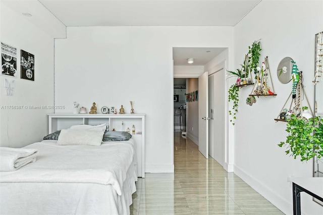 bedroom featuring baseboards