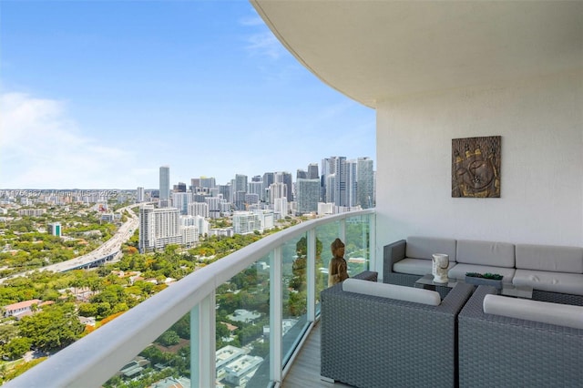 balcony with a view of city and outdoor lounge area