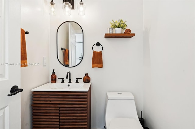 bathroom with toilet and vanity