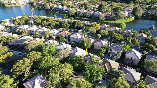 drone / aerial view with a residential view and a water view